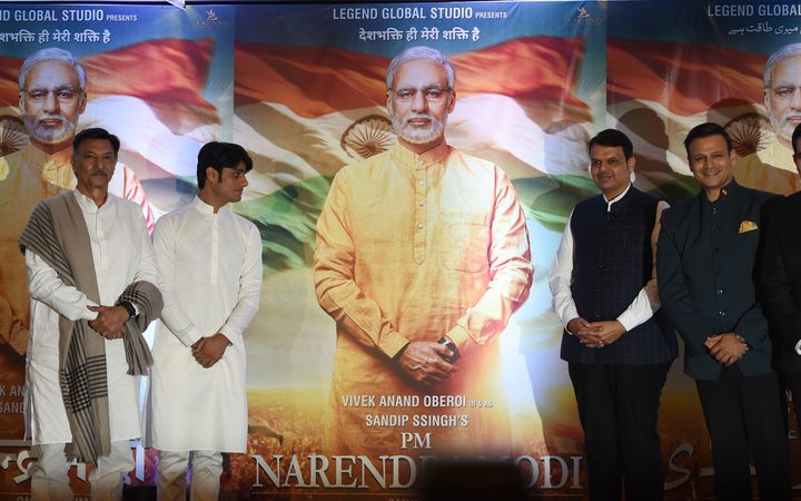 Actors and directors pose with posters of the upcoming Bollywood film  "PM Narendra Modi" - a biopic on Indian Prime Minister Narendra Modi. Actor Vivek Oberoi (2R) portrays the Indian Prime Minister in the film. 