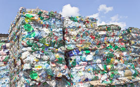 Stack of plastic bottles for recycling.