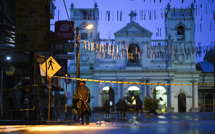 Sri Lankan soldiers stand guard under the rain at St. Anthony's Shrine in Colombo on April 25, 2019, following a series of bomb blasts targeting churches and luxury hotels on the Easter Sunday in Sri Lanka.