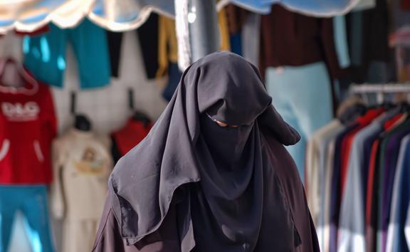 21293717 - woman in a burqa on the streets of egypt