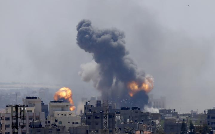 Smoke rises from an explosion caused by an Israeli airstrike in Gaza City, Saturday, May 4, 2019. 