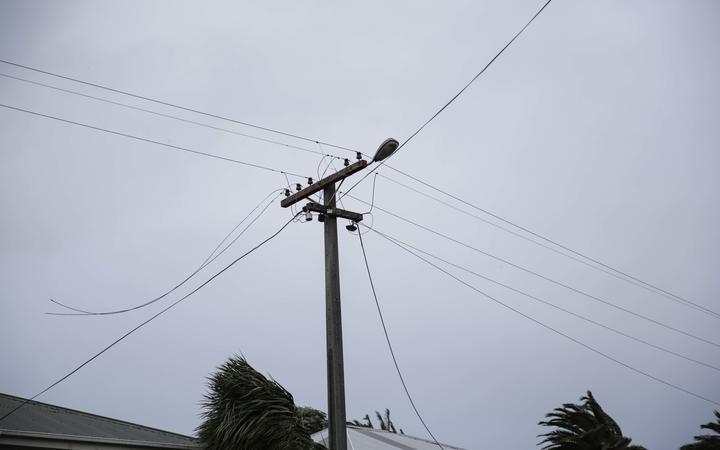 Powerlines down on Brougham St in Westport, live wires being cleared from the footpath.