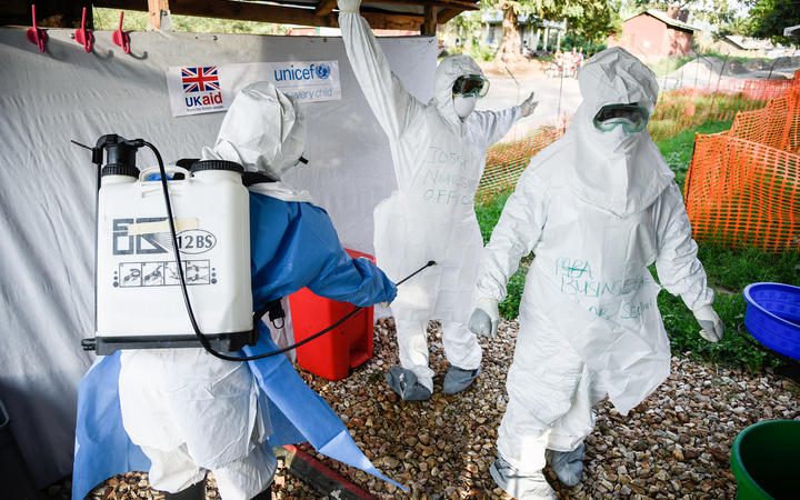 Medical staff of the Ebola Treatment Unit (ETU) get ready to work in their Personal Protective Equipment (PPE) during their weekly rehearsal at the Bwera General Hospital in Bwera bordering with DRC, western Uganda, on December 12, 2018.