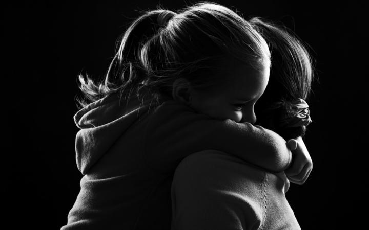 44113713 - black and white image of a little girl hugging her mother