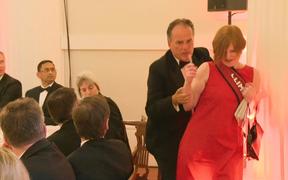 A still image taken from UK Pool video footage on June 21, 2019 shows Conservative MP Mark Field tackling a Greenpeace climate protester at a dinner at Mansion House in the City of London on June 21, 2019. 