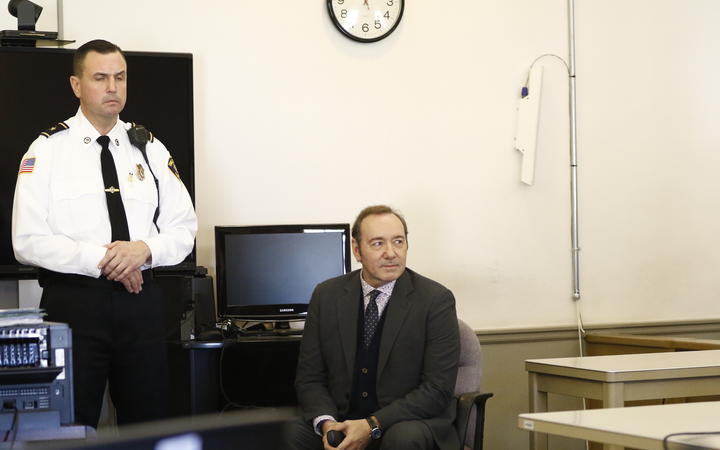 Kevin Spacey sits in chair while the legal teams meet during his arraignment at Nantucket District Court in Nantucket, Massachusetts on January 7, 2019. 