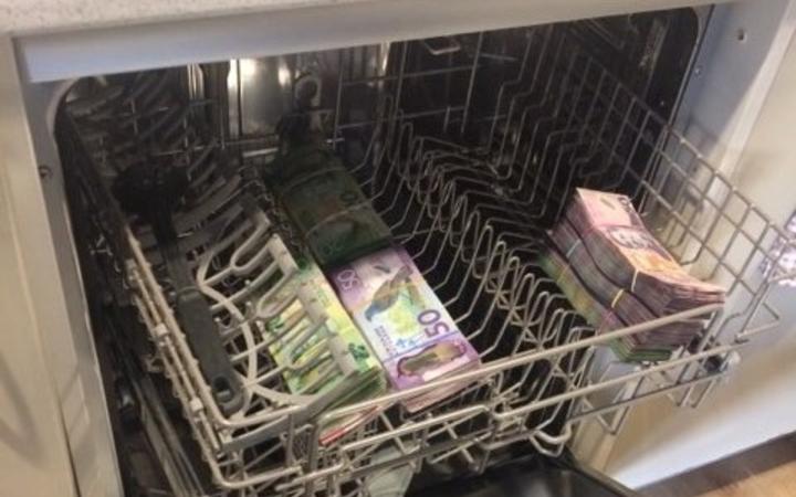 A dishwasher was found to have cash inside.