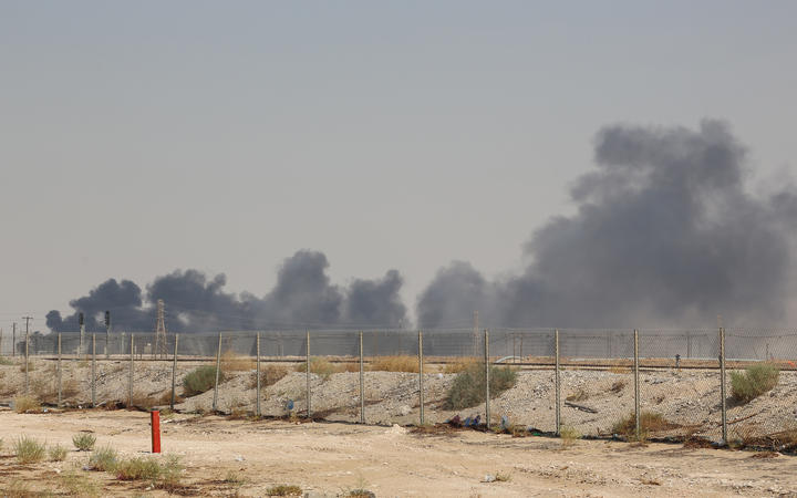 Smoke billows from an Aramco oil facility in Abqaiq about 60km southwest of Dhahran in Saudi Arabia's eastern province on 14 September.
