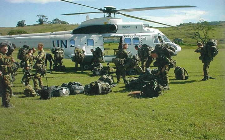 New Zealand troops preparing to board a United Nations Puma helicopter at Belulik Leten. The New Zealand company base at Belulik Leten was about a 12-minute helicopter flight from the battalion headquarters in Suai, but a three-and-a-half hour journey by road in good conditions.