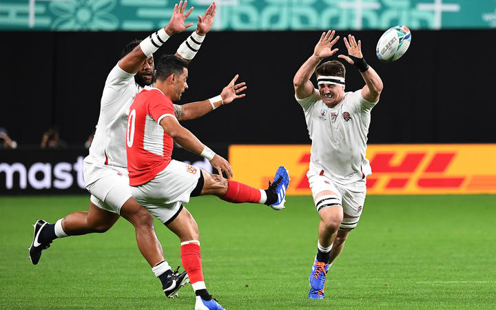 Kurt Morath clears the ball during Tonga's match against England