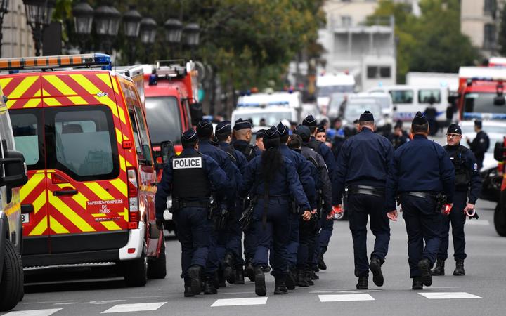 Police and military personnel block the bridge near Paris Police headquarters after four officers were killed in a knife attack on October 3, 2019 in Paris, France. 
