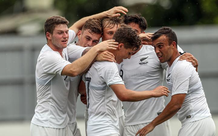 Members of the New Zealand Under 23 football side celebrate during their match against Solomon Islands in Fiji.