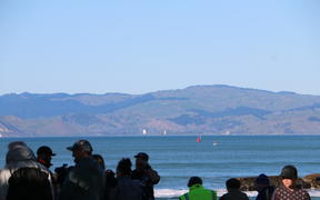 The Endeavour and the other tall ships sailed around past Te Kuri around 8am as onlookers gathered at Waikanae Beach to get a glimpse.