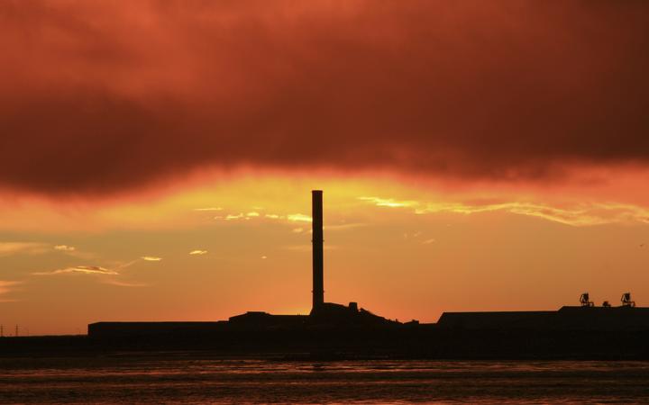 21586193 - a vibrant sunrise overlooking bluff aluminium smelter new zealand