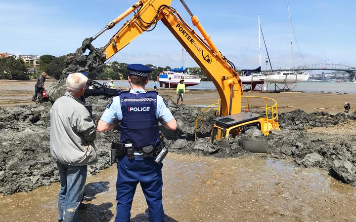 The digger has been stuck in the mud for four days.