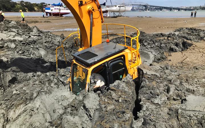 The digger becomes submerged up to its arm at high tide.