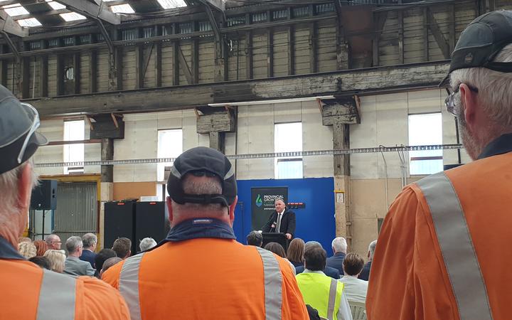 Workers listen as Regional Development Minister Shane Jones  announces nearly $$20m from the Provincial Growth Fund for upgrades.to Dunedin's Hillside workshop.