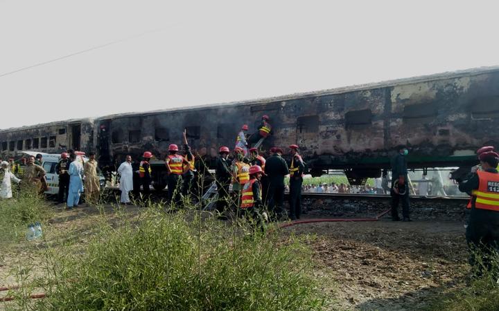 Pakistani rescuers shifting victims from a train after a fire erupted on board in southern Punjab province on 31 October, 2019.