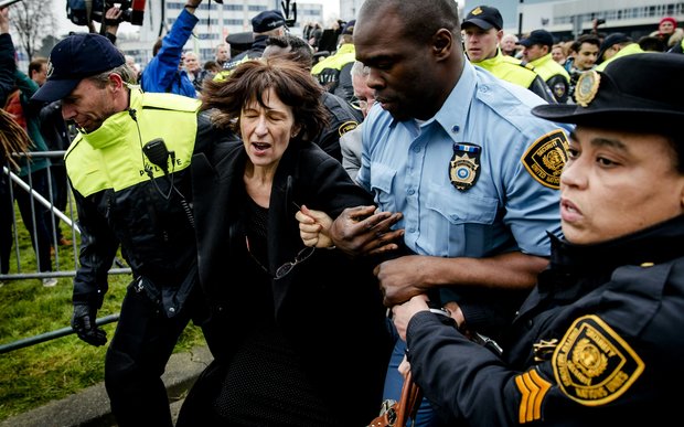 Florence Hartmann is arrested before the reading of the verdict against Bosnian Serb leader Radovan Karadzic on 24 March 2016.
