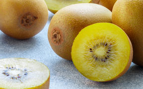 A stock photo of gold kiwifruit.