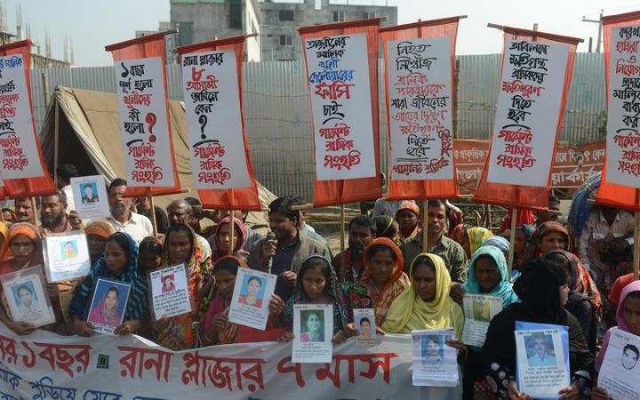 Survivors and relatives of Bangladeshi garment workers killed in the Tazreen Fashions fire accident and Rana Plaza garment factory building collapse react gather for a demonstration in Savar, on the outskirts of Dhaka on November 24, 2013. 