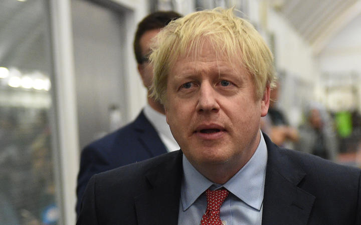 Britain's Prime Minister and Conservative leader Boris Johnson arrives at the count centre in Uxbridge, west London, as votes were counted as part of the UK general election.