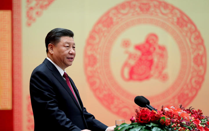 Chinese President Xi Jinping addresses a Chinese Lunar New Year reception at the Great Hall of the People in Beijing.