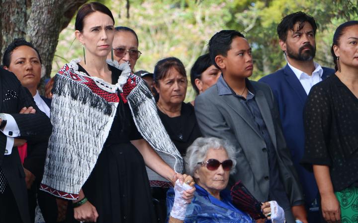 Prime Minister Jacinda Ardern holding hands with Titewhai Harawira as they are welcomed on to the Waitangi Treaty grounds. 