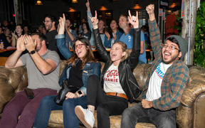 Supporters of Democratic presidential candidate Bernie Sanders cheer as they hear election results during a watch party. 