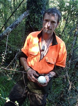 Ieuan Davies holds a rescued rowi egg