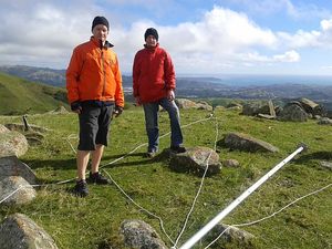 Mike Revell and Tony Bromley about to erect a 10-metre mast in the Belmont Hills