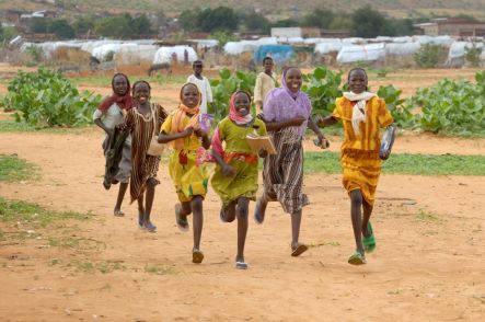 Girls running to school in Darfur