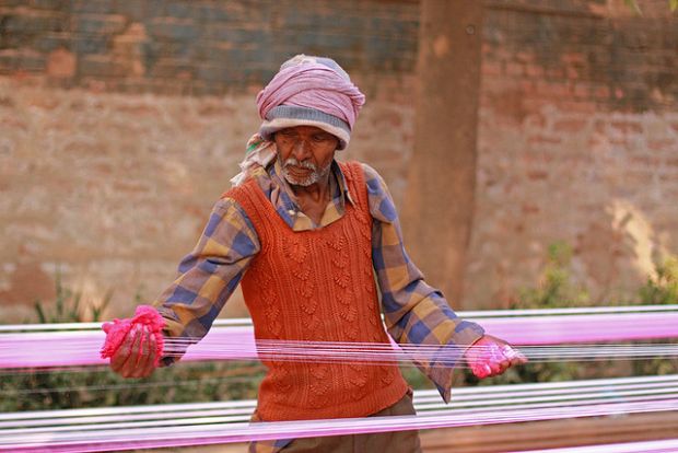 Coating kite string with coloured paste near Gujarat College Photo by Meena Kadri