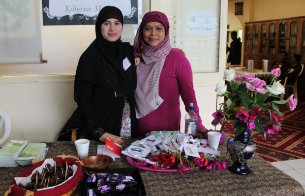 Asma and her friend welcome at the entrance Open day