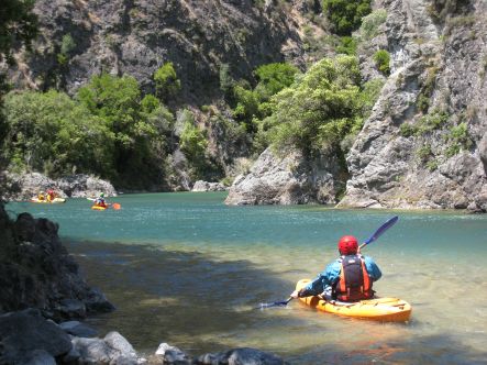 Kayaker with didymo in the foreground