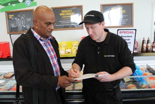 Bob Blake of the Mad Butchers in Kapiti signs