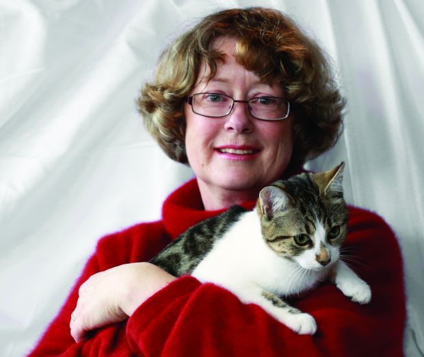Jane Newman with feral red zone kitten.