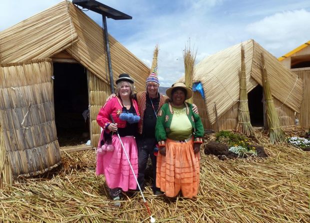 Julie Woods th Wonder Julie Ron and local lady infront of hut on reed island