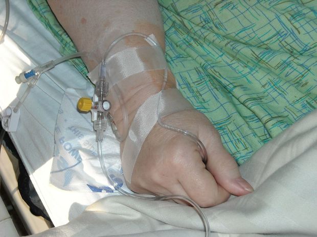 Euthanasia patient s hand with drip PD Pixabay