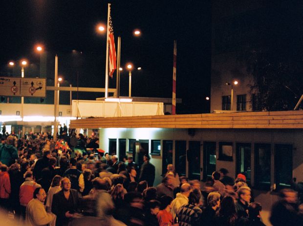 Some of the hundreds of people who came to Checkpoint Charlie to witness its historic opening on the evening of th November