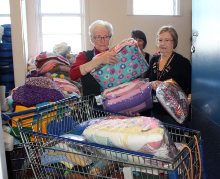 Knitting Natter Aileen and Leena loading the trolley at Kidz First small