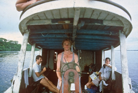 Odyssey Ross Doyle Chico Mendes steering a river boat up the Rio Negro