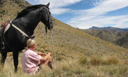 Hayley Pitts and her horse at Mt Gladstone Station.