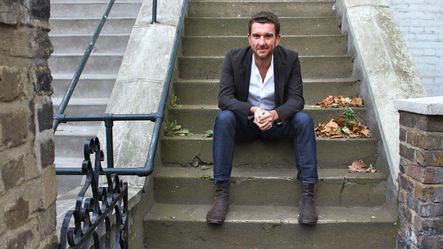 Chris Tubbs in front of his flat in Camden North London by Jason Moon