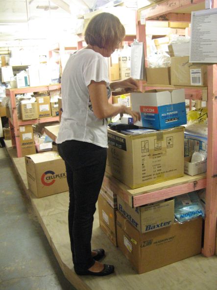 Med Aid April Volunteer Nurse Jane sorting surgical supplies small