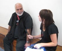 Reporter Natalie Mankelow speaking to a potential voter at a marae in Lower Hutt.