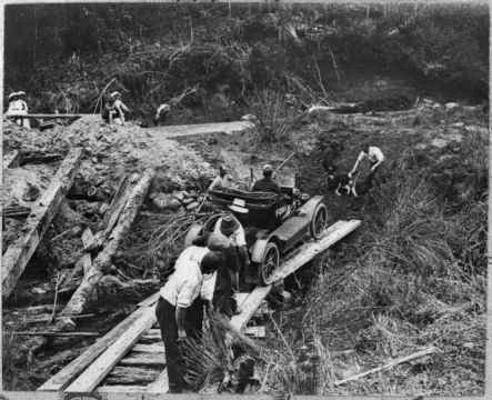 Mud Model T August Crossing on a makeshift bridge in the heart of the King country Courtesy National Library small