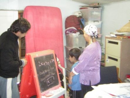 Overstayers create a makeshift classroom for their son, in the garage they call home
