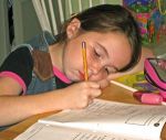 A school girl concentrating on her homework