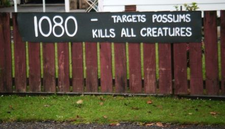 A protest message painted on a 1080 warning sign